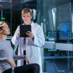 Scientist monitoring brain activity of a patient