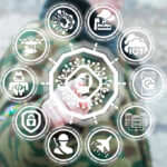 Person interacting with futuristic holographic interface and icons