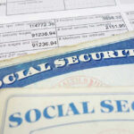 Social security cards on top of tax documents