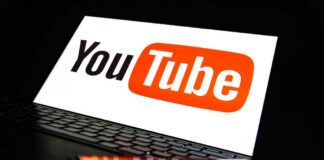 YouTube logo on a laptop and smartphone screen